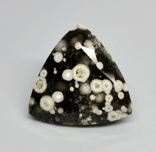 A black and white diamond with white spots.
