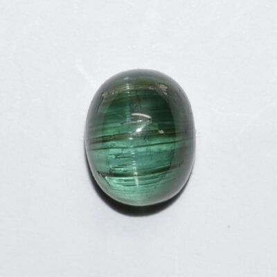 A green stone with a striped pattern on it.