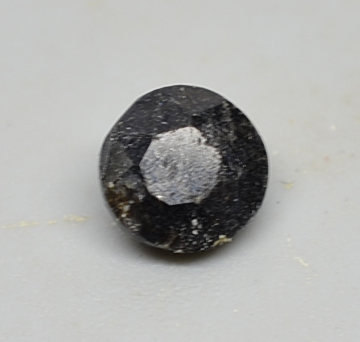 Zusmannite in Riebeckite 0.48 ct Round Cut 5.00mm P179
